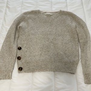 Knitted sweater with buttons